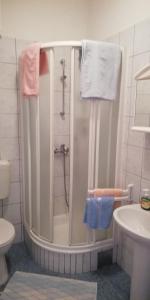 a bathroom with a shower and a sink at Apartments Miro with Sea view - near Beach in Sumartin +31 photos