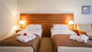 Postel nebo postele na pokoji v ubytování Hotel Trakošćan
