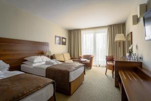 Postel nebo postele na pokoji v ubytování Hotel Trakošćan