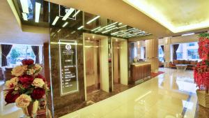a lobby of a hotel with flowers on the wall at Beethoven Premium Hotel in Istanbul +35 photos