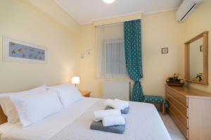 A bed or beds in a room at Villa Status