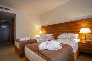 Postel nebo postele na pokoji v ubytování Hotel Trakošćan