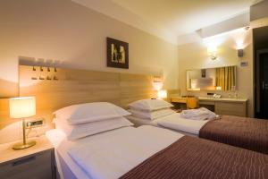Postel nebo postele na pokoji v ubytování Hotel Trakošćan