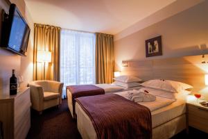Postel nebo postele na pokoji v ubytování Hotel Trakošćan