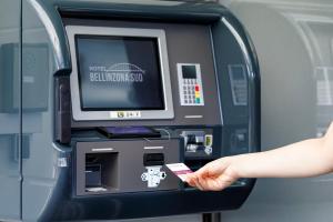 a person is withdrawing money from an atm machine at Hotel Bellinzona Sud Swiss Quality in Monte Carasso