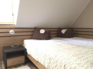 Posteľ alebo postele v izbe v ubytovaní Sétány Apartman