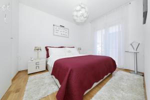 Postel nebo postele na pokoji v ubytování Luxury Apartman Rita, Center