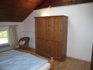 מיטה או מיטות בחדר ב-Ferienwohnung Hubner