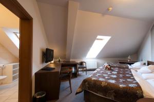 Postel nebo postele na pokoji v ubytování Hotel Mario