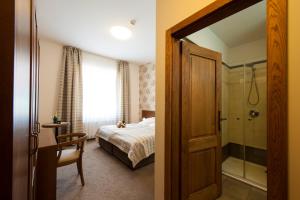 Postel nebo postele na pokoji v ubytování Hotel Mario