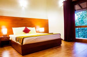 Letto o letti in una camera di Roshara Nalla
