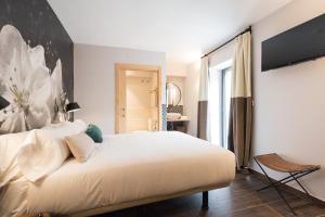 Voodi või voodid majutusasutuse Hotel Rural Sagarlore toas