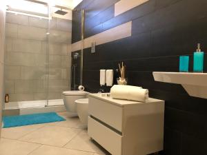 a bathroom with a sink and a toilet and a shower at Terra di Sicilia in Avola +47 photos