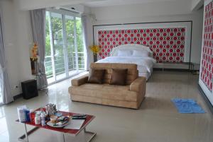 Postel nebo postele na pokoji v ubytování O.U.M. Hotel - โรงแรมโอยูเอ็ม
