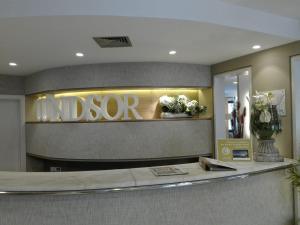 a lobby with a sign that reads indoco at Hotel Windsor in Funchal