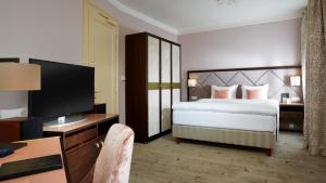 Postel nebo postele na pokoji v ubytování Aria Hotel Prague