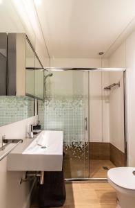 a bathroom with a sink and a shower at BmyGuest - Oura Beach Studio I in Albufeira