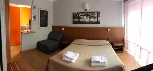 Hotel Rinaldo Apartment房間的床