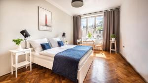 Posteľ alebo postele v izbe v ubytovaní Sereno Apartments