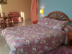 Postel nebo postele na pokoji v ubytování Hotel Laberinto