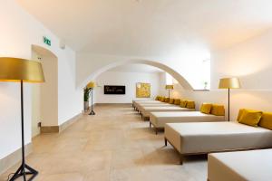 a row of couches in a waiting room at Parkhotel Graz - Traditional Luxury in Graz