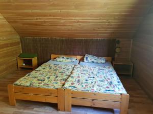 Łóżko lub łóżka w pokoju w obiekcie Pensjonat Danielka