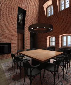 a wooden table and chairs in a room with a brick wall at Hotel Kleis in Cvikov