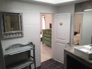 a bathroom with a sink and a mirror at Vinha da Quinta in Sintra