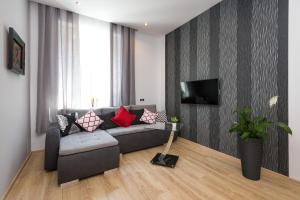 Televízia a/alebo spoločenská miestnosť v ubytovaní Kazimierz Residence