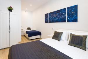 Posteľ alebo postele v izbe v ubytovaní Kazimierz Residence