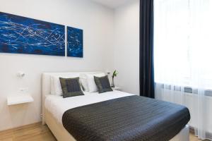 Posteľ alebo postele v izbe v ubytovaní Kazimierz Residence
