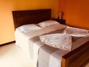 Krevet ili kreveti u jedinici u okviru objekta Crown Holiday Village near Marawila