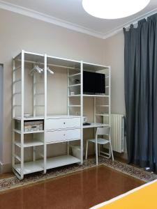 TV a/nebo společenská místnost v ubytování Casa Isabela luxury rooms