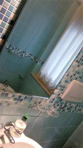 a bathroom with a sink and a mirror at B&B In Centro in San Benedetto del Tronto +47 photos
