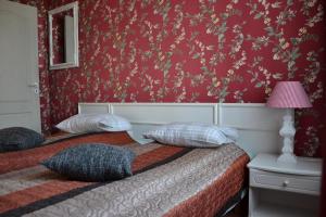 Postel nebo postele na pokoji v ubytování City Center Kaķis B&B