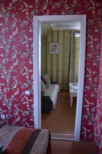 Postel nebo postele na pokoji v ubytování City Center Kaķis B&B
