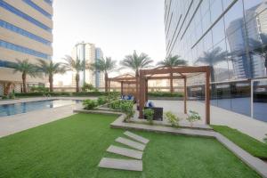 a garden with a gazebo in a building at Makkah Al Aziziah in Makkah