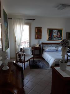 A bed or beds in a room at Locanda Bellavista