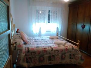 Postel nebo postele na pokoji v ubytování B&B Tisoi