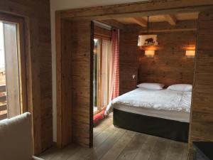 Postel nebo postele na pokoji v ubytování Verbier Valmont in center