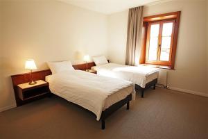Postel nebo postele na pokoji v ubytování Galion Hôtel & Restaurant