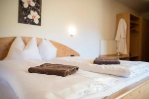 Letto o letti in una camera di Hotel Alpin