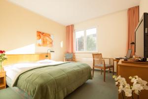 
Ein Bett oder Betten in einem Zimmer der Unterkunft Apart Hotel Gera

