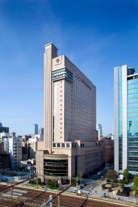 a large building with a large clock on it at Dai-ichi Hotel Tokyo in Tokyo