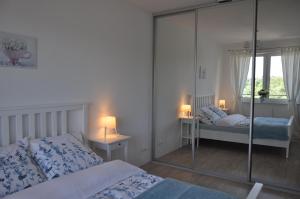 Posteľ alebo postele v izbe v ubytovaní Apartament Zielone Tarasy