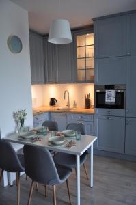 Kuchyňa alebo kuchynka v ubytovaní Apartament Zielone Tarasy