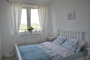 Posteľ alebo postele v izbe v ubytovaní Apartament Zielone Tarasy