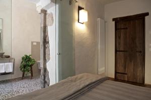 A bed or beds in a room at Maison Bondaz & SPA privé