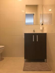 a bathroom with a sink and a toilet at Castle Apartment in Alicante +26 photos