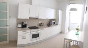 Amplio y luminoso apartamento con vistasにあるキッチンまたは簡易キッチン